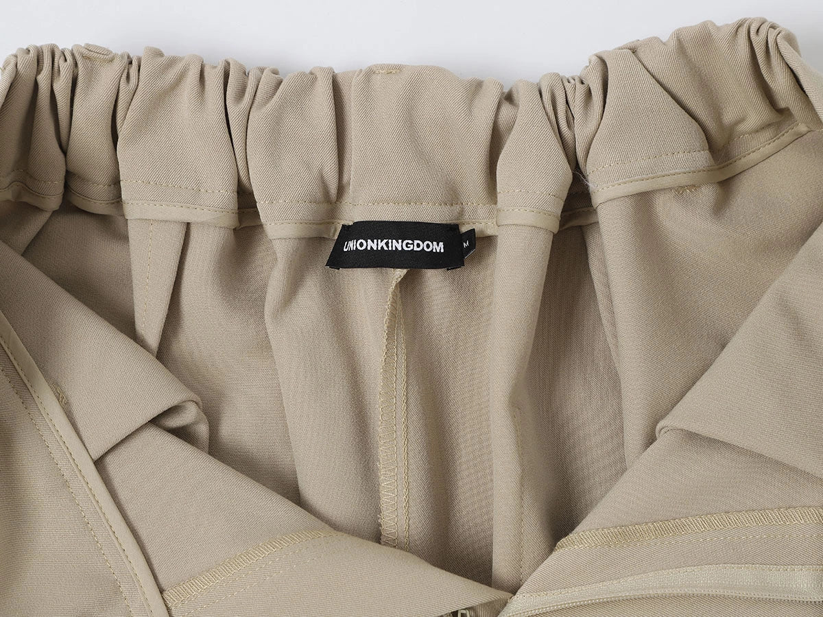 LOOSE FIT PLEATED 'SAND' SHORTS