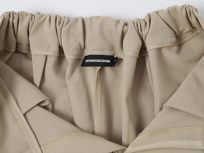 LOOSE FIT PLEATED 'SAND' SHORTS